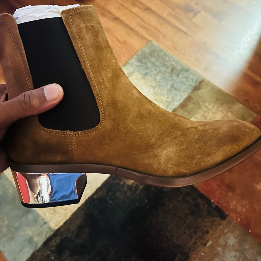 Nice stylish Aldo boot with silver bottom